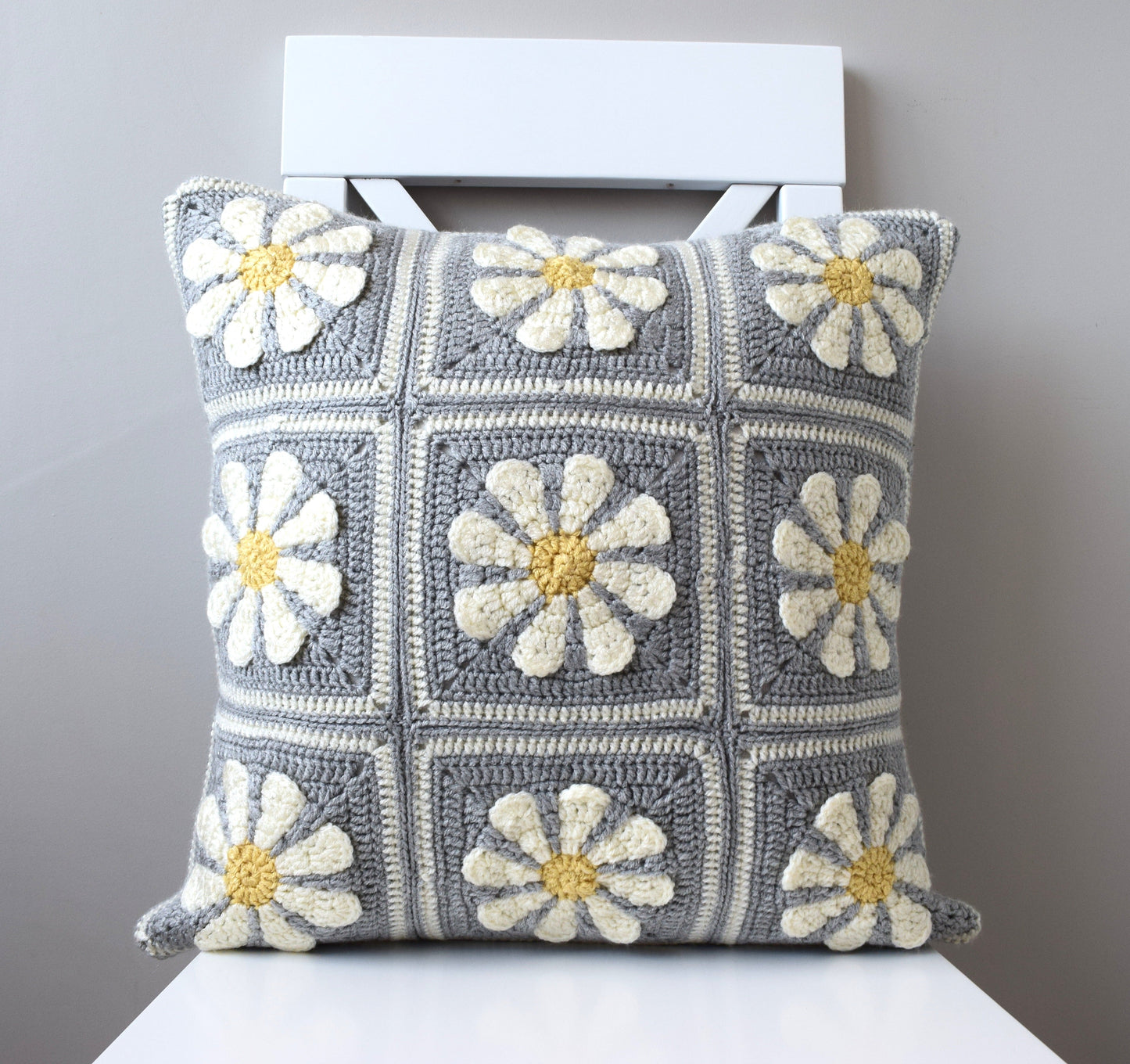 just cushions hand crochet cushion grey and white with white and yellow daisies granny squares cushion handmade in the uk