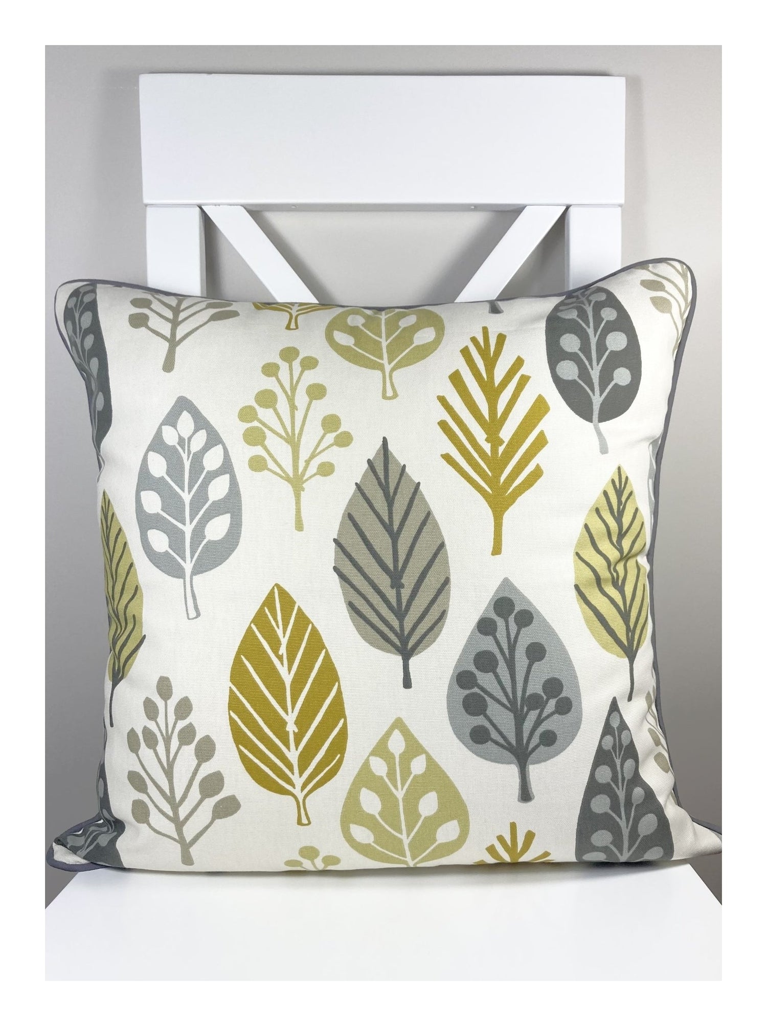 just cushions magda scandi cushion tree and leaf patterned cushions with piping.  yellow cream and grey handmade in the uk